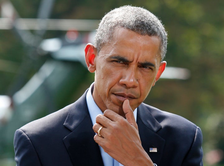 U.S. President Barack Obama pauses as he speaks to the media on the situation in Iraq on the South Lawn of the White House, before his departure for vacation at Martha's Vineyard, in Washington August 9, 2014.