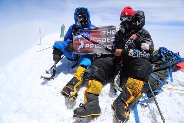 Marine Corps veteran Charlie Linville (left) and The Heroes Project founder and expedition leader Tim Medvetz pictured atop Mount Everest on Thursday. 