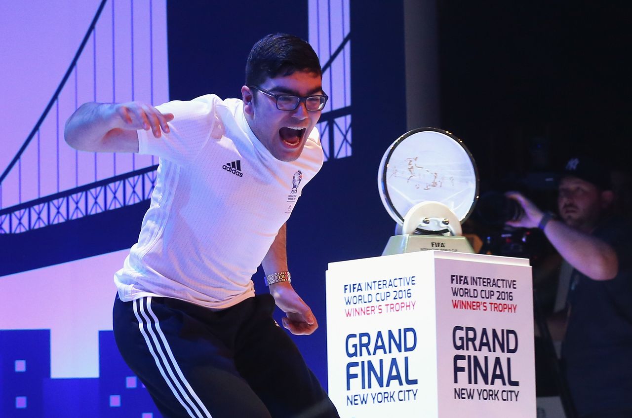 Mohamad Al-Bacha of Denmark, above, faced off against Sean Allen of England in the FIFA Interactive World Cup Final at New York's Apollo Theater on March 22, 2016.
