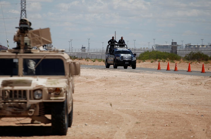 Federal forces keep watch on the perimeter of a high security prison where El Chapo is imprisoned in Ciudad Juarez, Mexico on May 20, 2016.