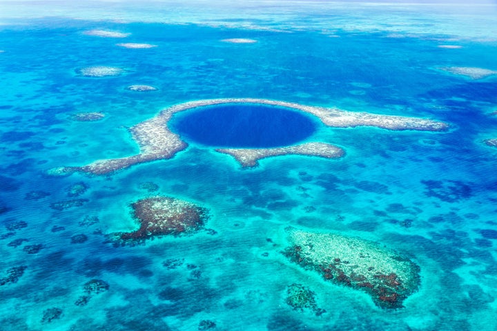 Aerial of the Blue Hole, Lighthouse reef, Belize. It's the largest marine sinkhole in the world.