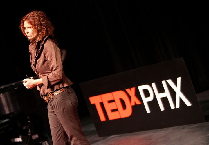 Poynter delivering a Tedx talk about her experiences