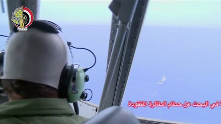 A pilot looks out of the cockpit during a search operation by Egyptian air and navy forces for the crashed EgyptAir plane in the Mediterranean Sea.