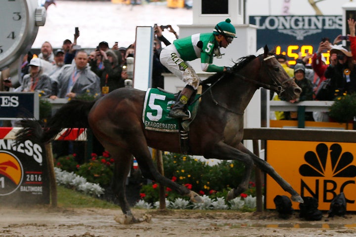 Kent Desormeaux aboard Exaggerator (5) wins the 141st running of the Preakness Stakes at Pimlico Race Course.
