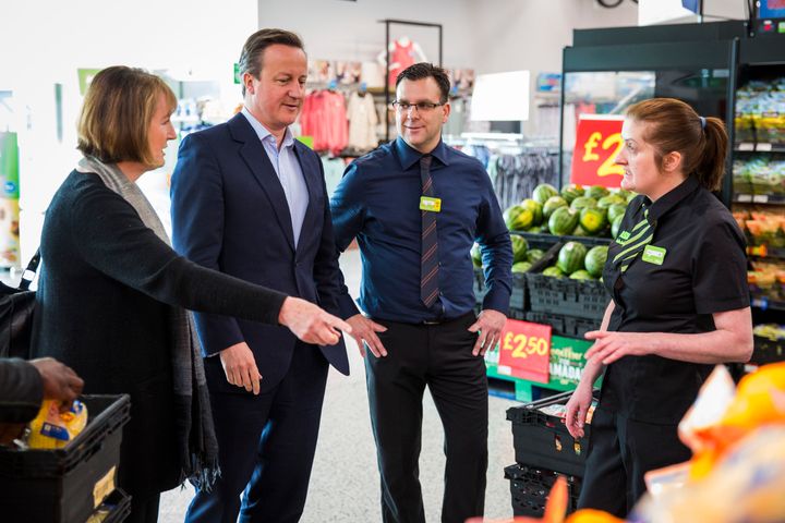 <strong>Cameron and Labour's Harman speak to Asda employees.</strong>