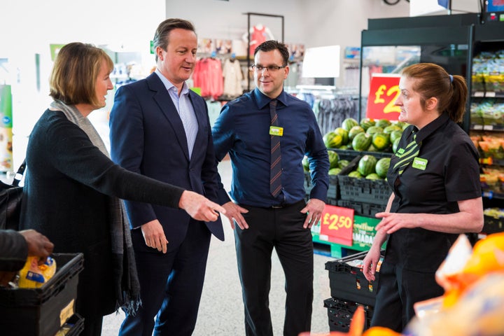 Cameron and Labour's Harman speak to Asda employees.