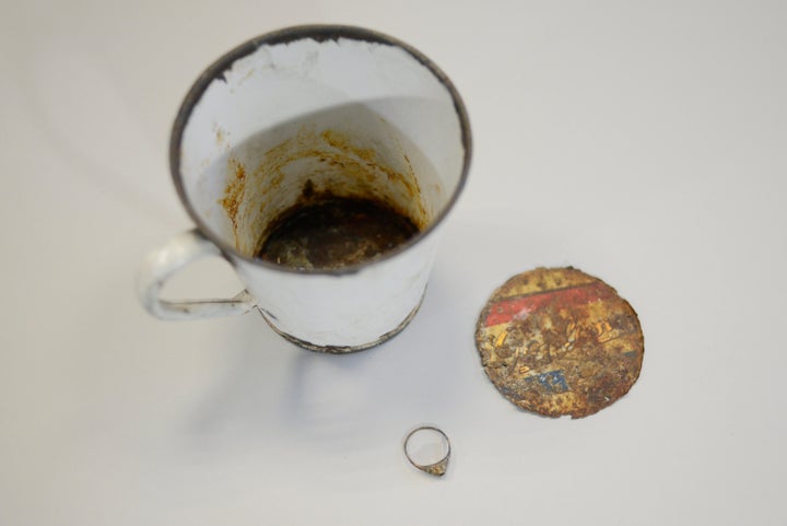 A gold ring was found hidden in the false bottom of a mug that was on display at the Auschwitz Museum in Poland.