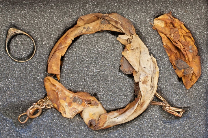 A gold ring and necklace were found hidden in the false bottom of a mug at Auschwitz. 