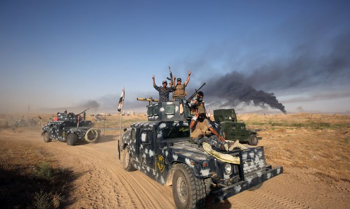 Iraqi pro-government forces advance towards the city of Falluja as part of a major assault to retake the city from ISIS.