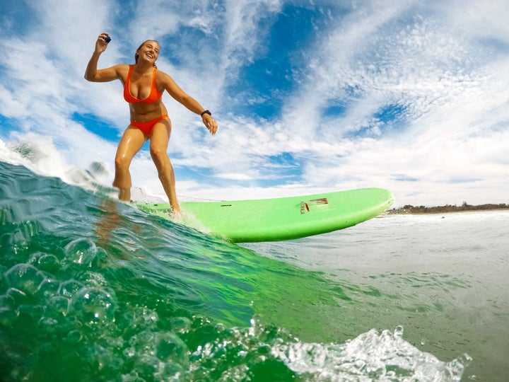 Professional standup paddler Izzi Gomez catches a wave in the Gold Coast, Australia.