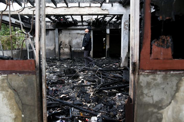 Preliminary forensic studies suggested that a hot fragment from a faulty fluorescent light fell on the floor and started the fire. The girls likely died due to smoke inhalation.