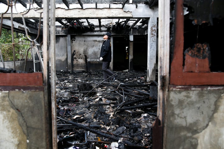Preliminary forensic studies suggested that a hot fragment from a faulty fluorescent light fell on the floor and started