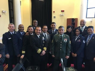 Hanif Sangi, in the green uniform in the front row, stands with fellow Muslims in the United States military during President Barack Obama's first visit to a mosque in February 2016.