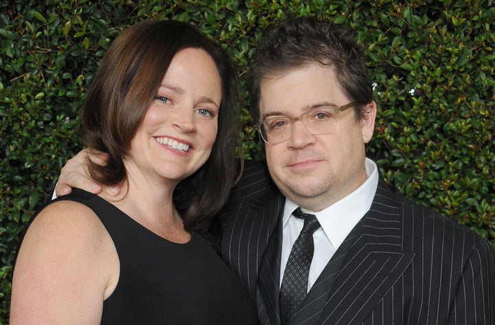 Actor Patton Oswalt and wife Michelle McNamara arrive at the "Young Adult" Los Angeles Premiere on December 15, 2011, in Beverly Hills, California.