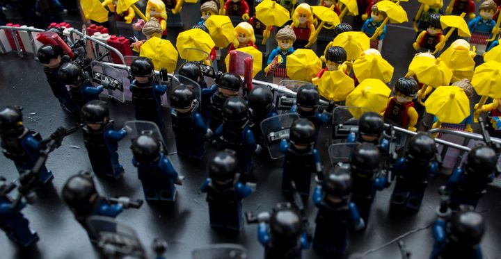 Toy Lego characters depicting a scene of protesters confronting riot police are seen on a table outside the government headquarters in Hong Kong October 20, 2014.