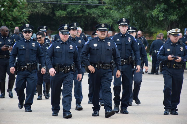 Policemen arrive at the funeral for Harris County Deputy Darren Goforth in Houston on Sept. 4, 2015.