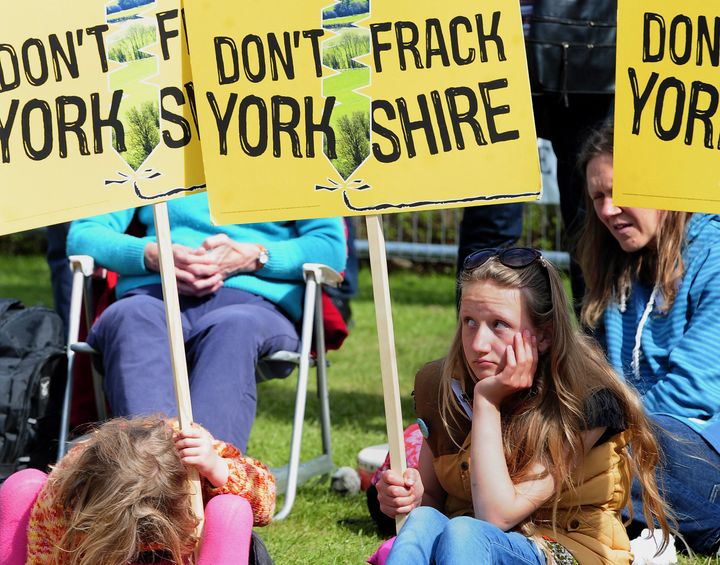 Young protestors demonstrating against fracking wait outside County Hall, Northallerton, in North Yorkshire.