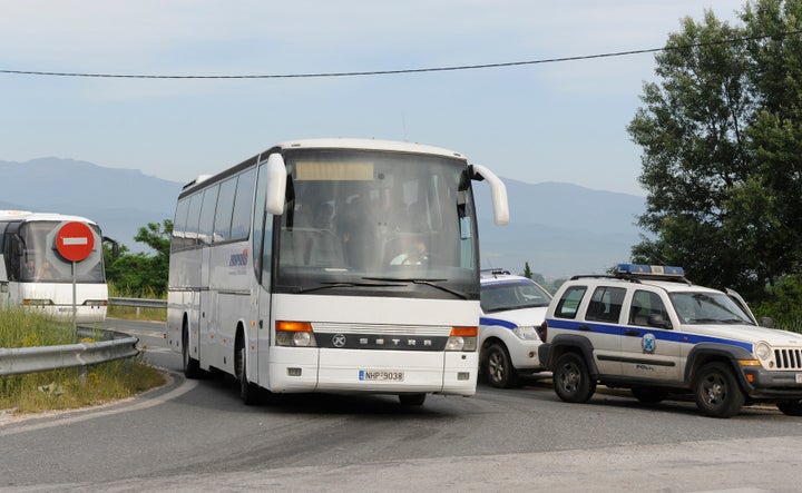 Four to six bus loads of migrants left the makeshift camp early Tuesday, with about another dozen more lined up.