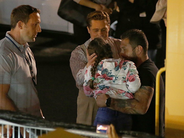 Pitt speaking to the young girl after she was pulled out of the crowd.