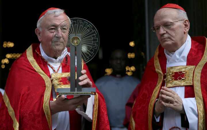 Archbishop of Westminster Cardinal Vincent Nicolls (L) receives the Hungarian relic of St Thomas a Becket from Archbishop of Esztergom-Budapest Cardinal Peter Erdo before a ceremony at Westminster Cathedral in London, Britain May 23, 2016.