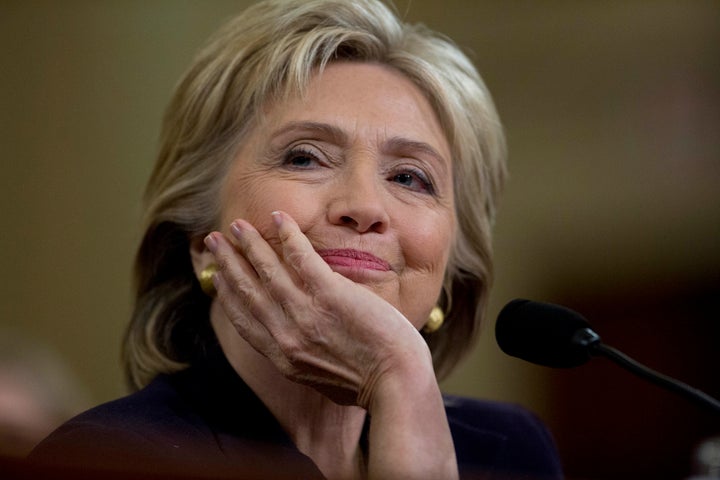 Hillary Clinton, former U.S. secretary of state and 2016 Democratic presidential candidate, smiles while testifying during a House Select Committee on Benghazi hearing in Washington, D.C., U.S., on Thursday, Oct. 22, 2015.