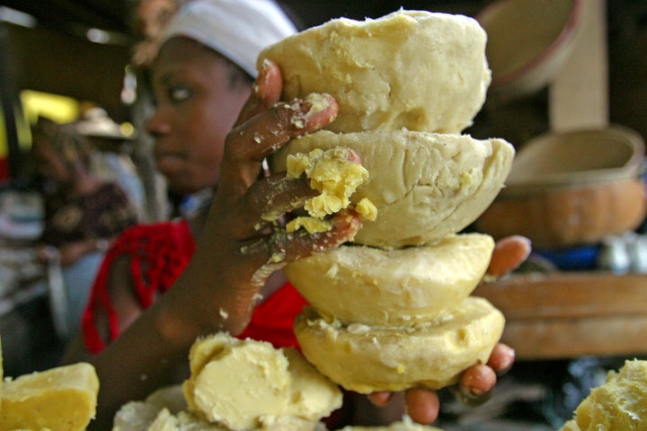 A woman sells shea butter at a street market in Ivory Coast's main city of Abidjan.