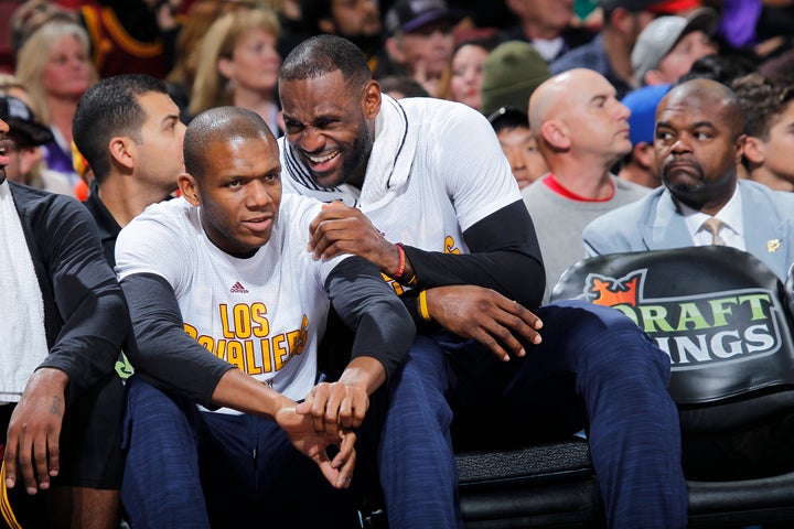 NBA legend James Jones and his teammate share a laugh during a game against the Sacramento Kings on March 9, 2016.