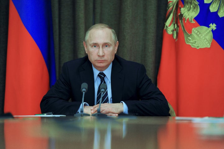 Russian President Vladimir Putin chairs a meeting with military officials at the Bocharov Ruchei state residence in Sochi, Ru