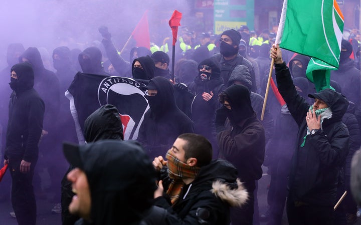 Anti-fascist protesters break through police lines as they clash with right wing protestors, as both groups gather in Dover, Kent.