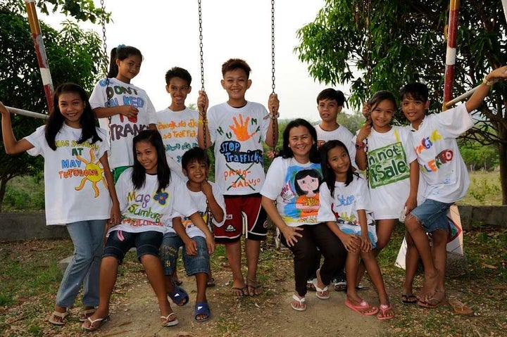 Cecilia with children from a community vulnerable to trafficking.