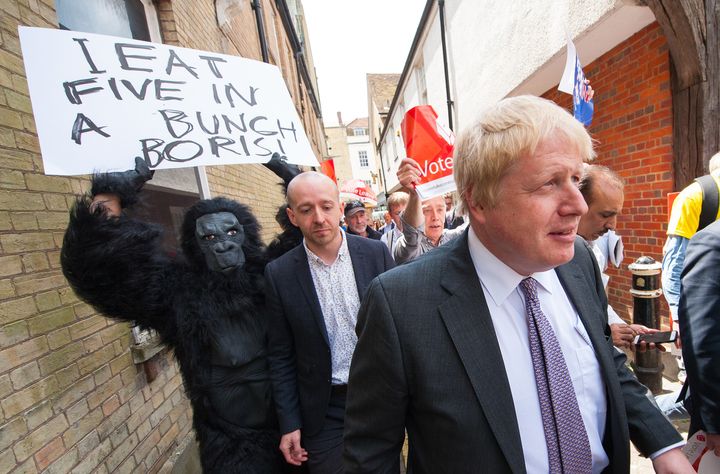 Boris Johnson is followed by a Remain activist