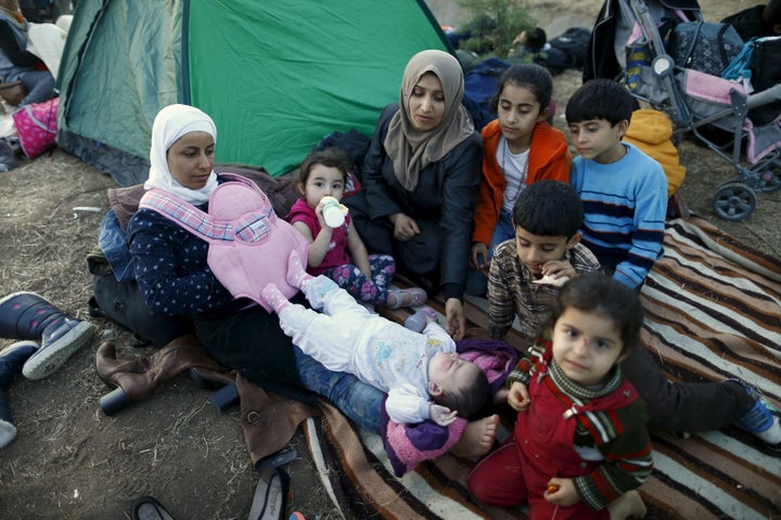 Migrants rest while making their way towards the Greek border, on a road near Edirne, Turkey.