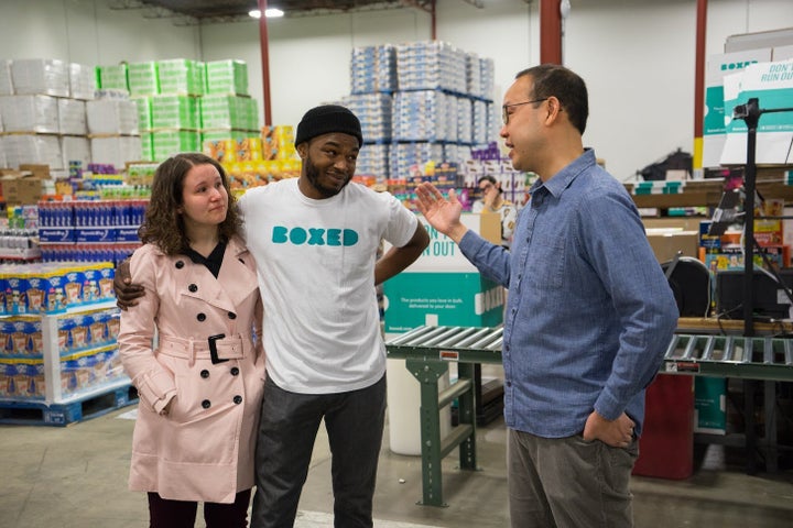 Boxed CEO Chieh Huang, right, surprised employee Marcel Graham and his fiancee, Tara Aucoin, with the news that the company would spring for their wedding.