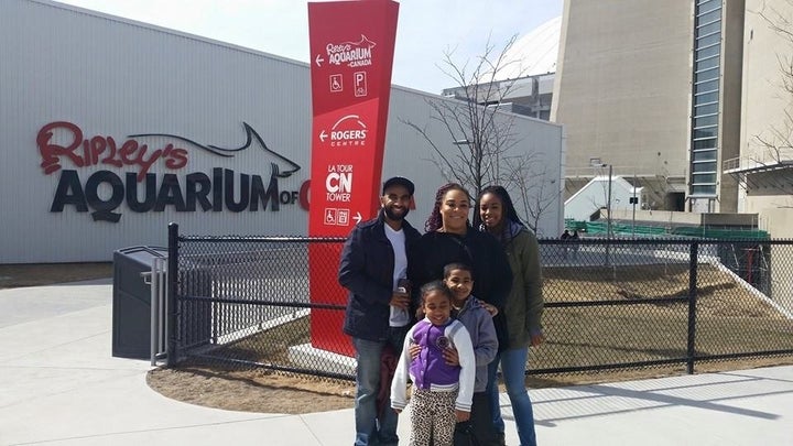 Janella and her family on a trip to the aquarium. 