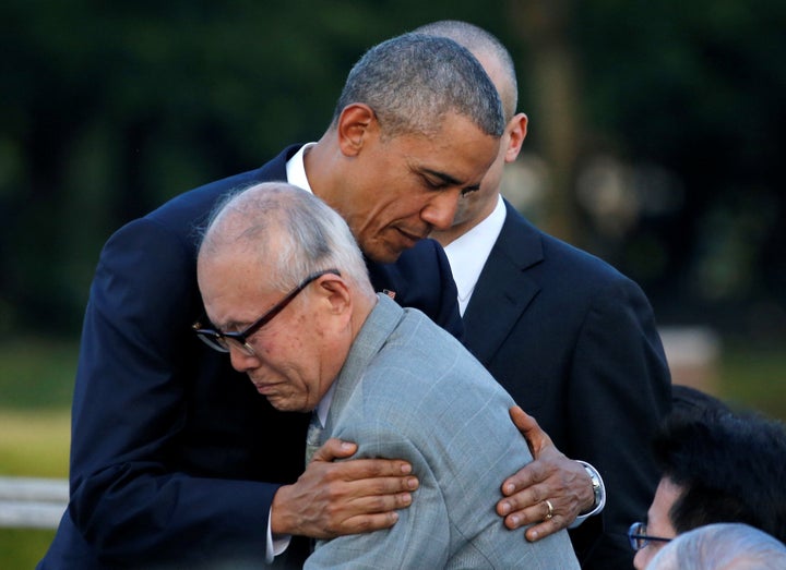 President Barack Obama hugs with atomic bomb survivor Shigeaki Mori as he visits Hiroshima Peace Memorial Park in Hiroshima,