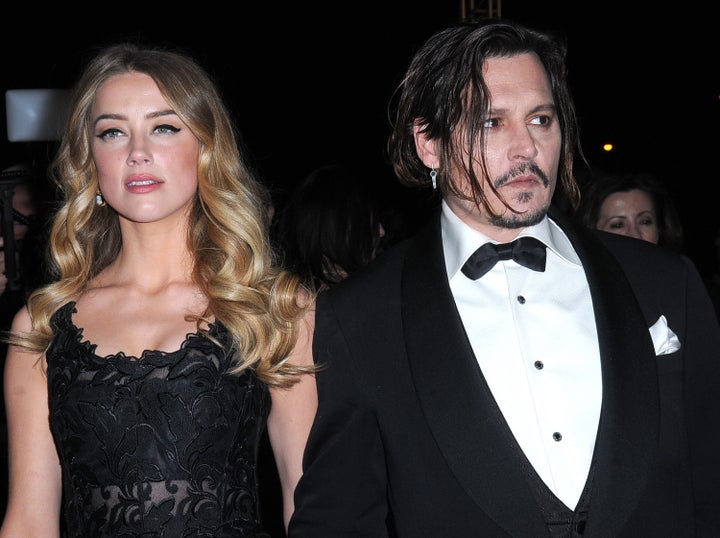 Amber Heard and Johnny Depp arrive at the 27th Annual Palm Springs International Film Festival on Jan. 02, 2016 in Palm Springs, California.