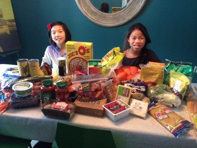 Hayley Hoppe's daughters were shocked when a Facebook friend who she's never met arranged to have a month's worth of groceries donated by Trader Joe's delivered.