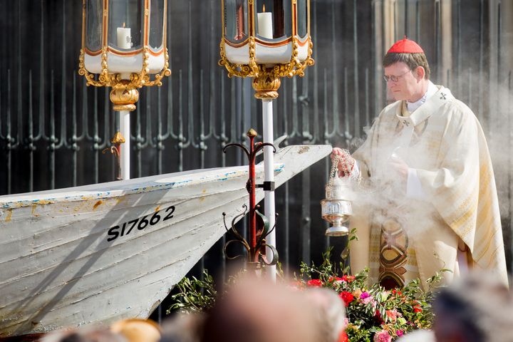 Cardinal Woelki celebrated the Corpus Christi Mass at the boat in memory of thousands of migrants who lost their lives in the Mediterranean sea.