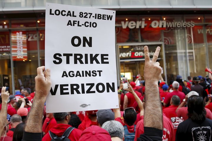 People demonstrate outside a Verizon wireless store in New York on April 18, 2016.