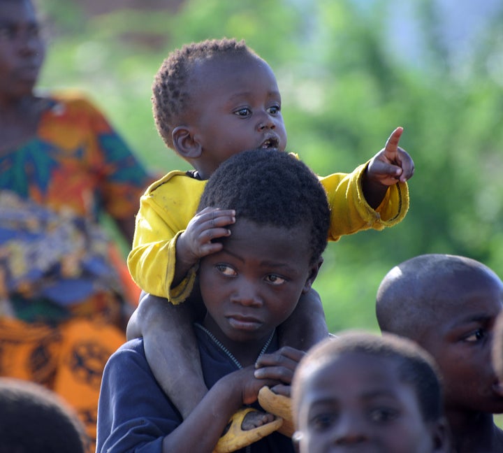 To go with story by Herve Bar A group of newly arrived South Sudanese refugee children,walk infront of an adult in the Kakuma refugee camp, North-Western Kenya on September 6, 2010. Fourteen different nationalities co-habit at the Kakuma UNHCR sit which was set up in 1992 initially to shelter south Sudanese fleeing the war. Today Somalis are in the majority, representing 56 percent of the camp's inhabitants, way ahead of the south Sudanese (30 percent), many of whom have gone back home with the return of peace. AFP PHOTO/SIMON MAINA (Photo credit should read SIMON MAINA/AFP/Getty Images)