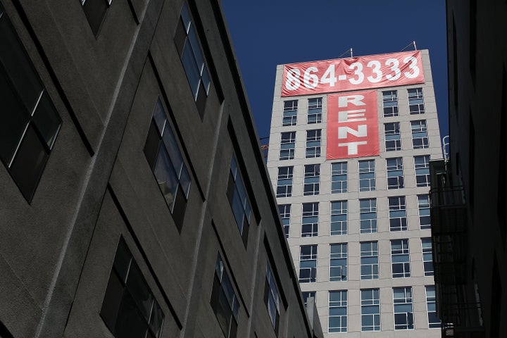 A banner advertising units for rent hangs on the side of an apartment building in San Francisco. San Francisco is t