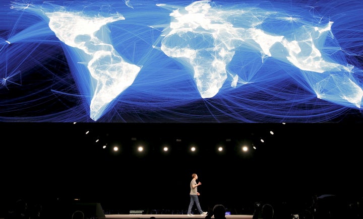 Facebook CEO Mark Zuckerberg appears below an illustration showing how his social network connects the world.