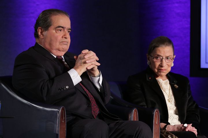 Supreme Court Justices Antonin Scalia (L) and Ruth Bader Ginsburg (R) wait for the beginning of the taping of "The Kalb Report" on April 17, 2014, at the National Press Club in Washington, D.C.