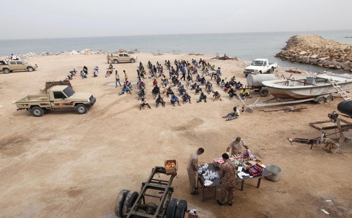 Migrants who attempted to flee to Europe are held at the coastguard center in the coastal city of Tripoli in October.