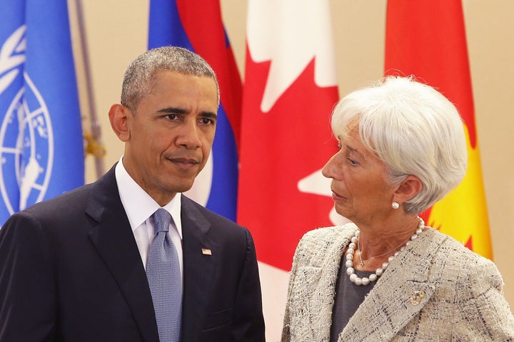IMF managing director Christine Lagarde speaks with President Barack Obama at the G-7 conference. Critics argue that the