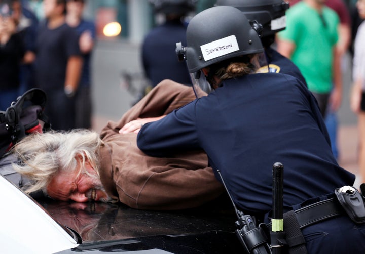 A man is arrested during a demonstration against presumptive GOP nominee Donald Trump outside his campaign event in San Diego on Friday.