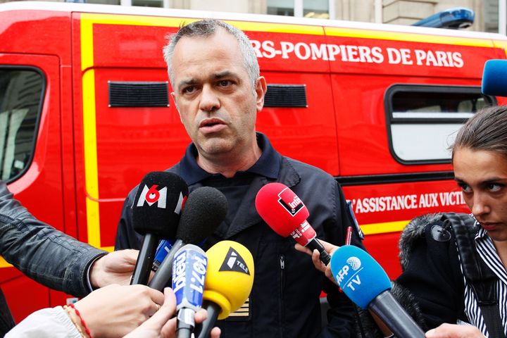 Fire chief Eric Moulin speaks to journalists near the scene in Paris