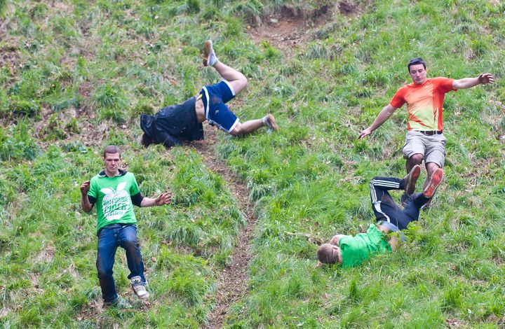 The annual Cheese Rolling Race at Coopers Hill in the village of Brockworth, involves rolling a 9 lb. round of Double Gloucester cheese down the hill with competitors chasing after it.