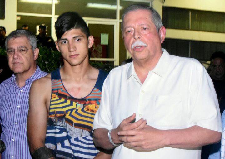 Mexico's striker Alan Pulido is seen next to Tamaulipas State Governor Egidio Torre Cantu after he escaped. Police have detained the captor, one of least four involved.