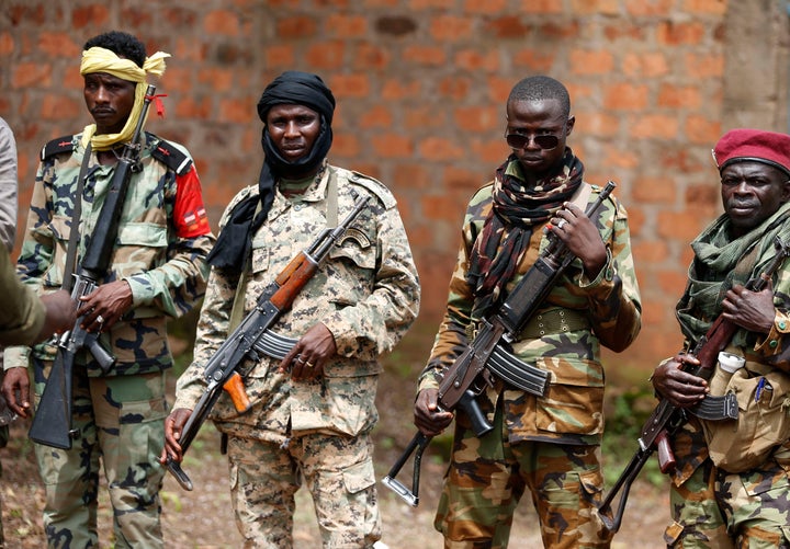 Seleka fighters stand in line at a Seleka base in Bambari in May 2014. Although the mainly Muslim militia were officially disbanded in 2013, ex-Seleka continue to control much of the city.